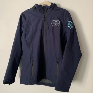 Kracken Rum raincoat with Seattle Kracken emblem on the sleeve